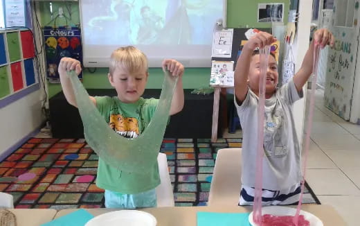 a couple of kids in a classroom