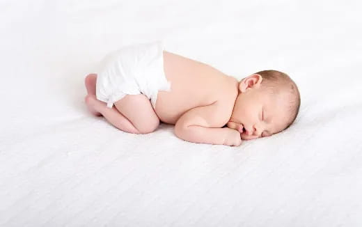 a baby lying on its back