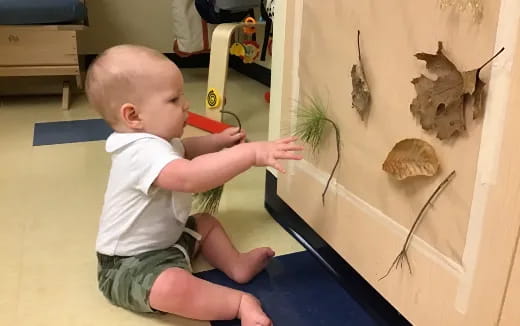 a baby playing with a toy