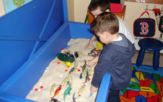 a couple of boys playing with toys