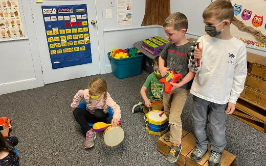 a group of kids playing with toys