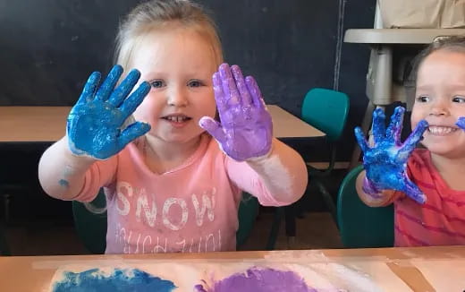 a couple of children wearing clothing
