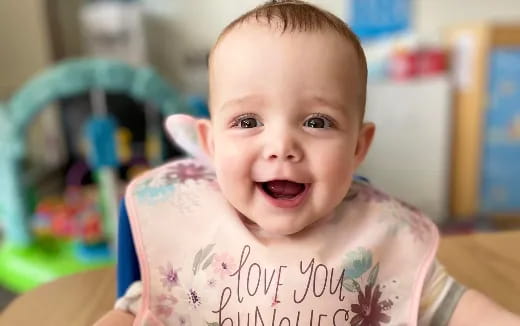 a baby with a note