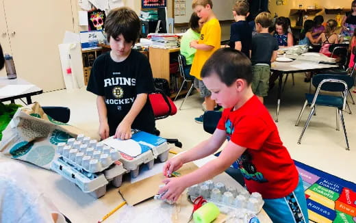 a few boys playing with toys