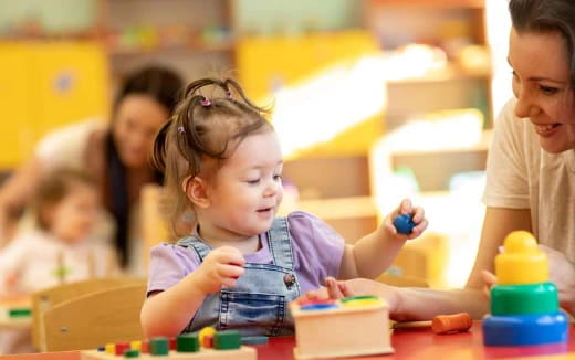 a young girl playing with toys
