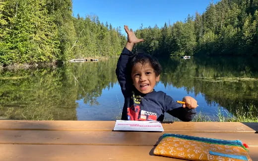a boy sitting on a boat