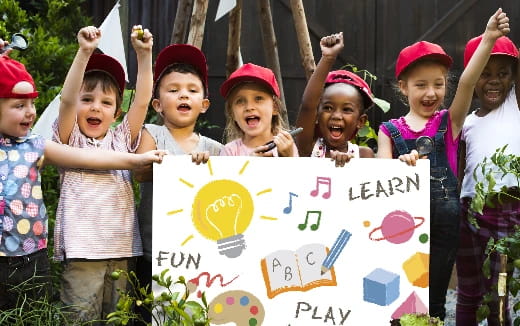 a group of children holding a sign