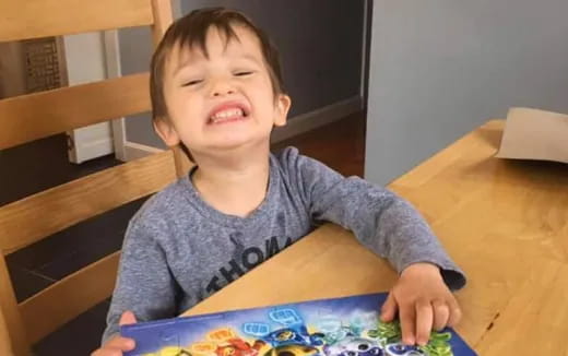 a child sitting at a table