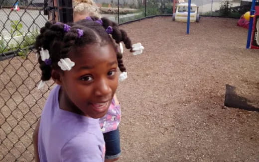 a girl with a flower in her hair