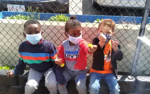 a group of boys wearing face masks
