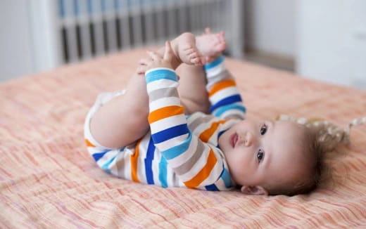 a baby lying on its back