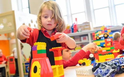 a young girl playing with toys