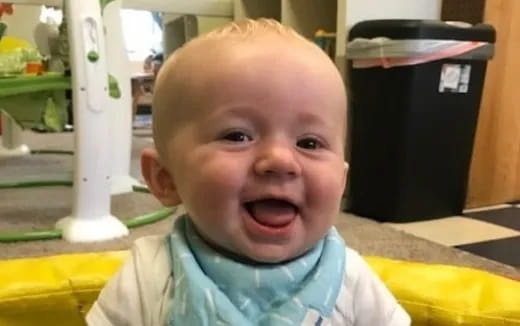 a baby with a surprised expression