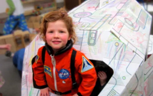 a boy in a red jacket