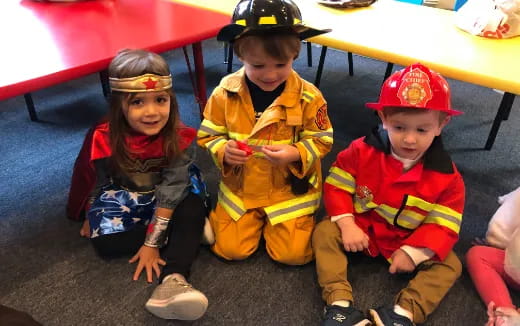 a group of children sitting on the floor