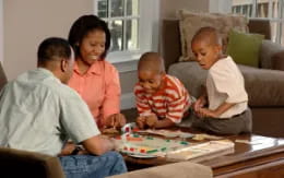 a group of people playing a board game