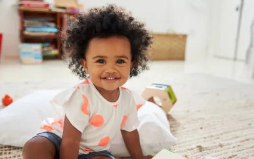 a child sitting on the floor