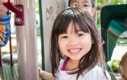 a girl smiling at the camera