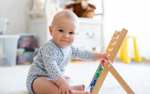 a baby sitting on the floor