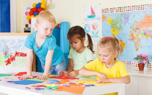a few children playing with a puzzle