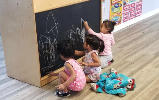 a group of children sitting on the floor