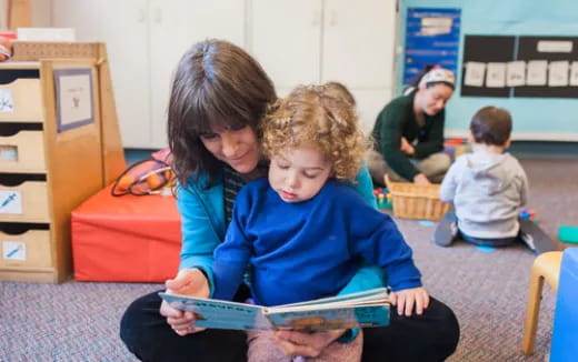 a few children reading a book