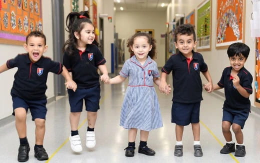 a group of children in school uniforms