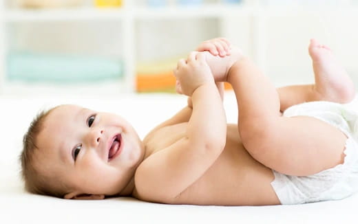 a baby lying on its back