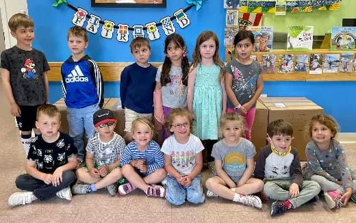 a group of children posing for a photo