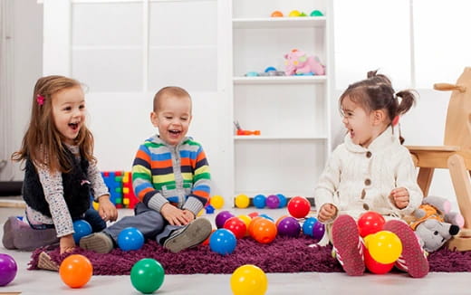a group of children playing with balls