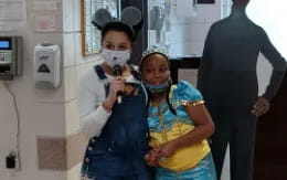 a couple of people wearing masks