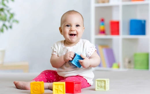 a baby sitting on a table