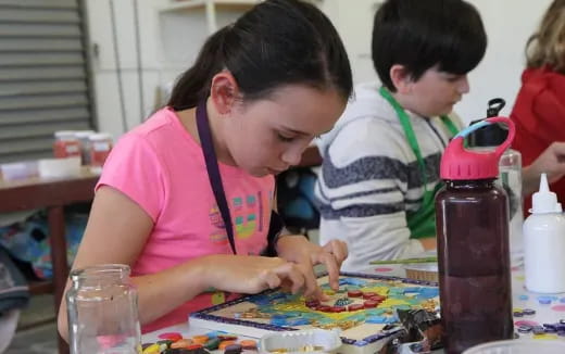 a person and a boy painting