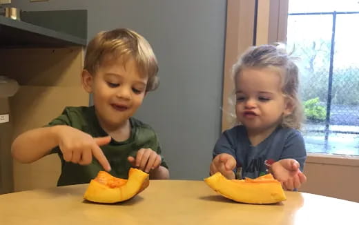 two children sitting at a table