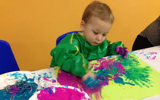 a child sitting at a table