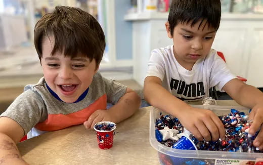 a couple of boys playing with a toy