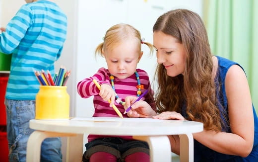 a person and a child painting