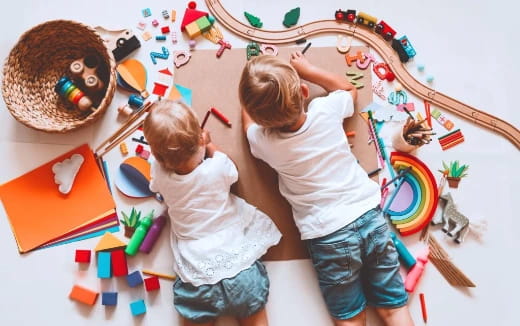 a couple of children playing with toys