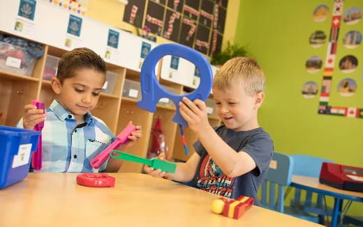 a couple of boys playing with toys