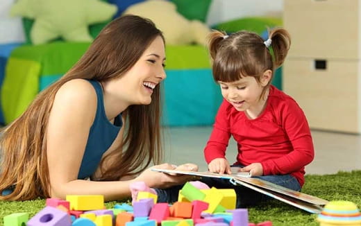 a woman and a child playing with toys