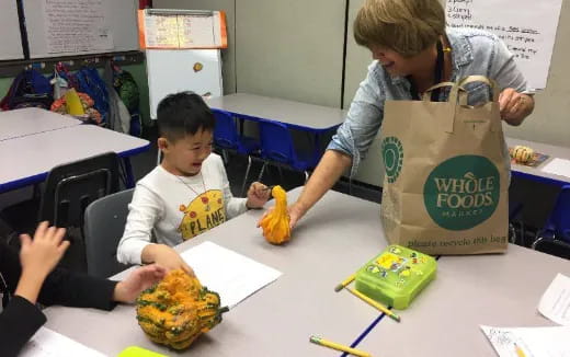 a person and a child in a classroom