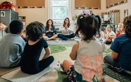 a group of children sitting on the floor