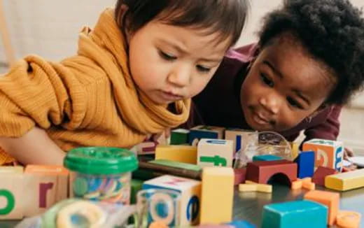a couple of kids playing with toys