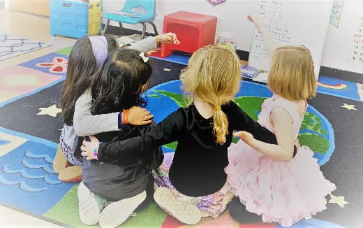 a group of children sitting on the floor