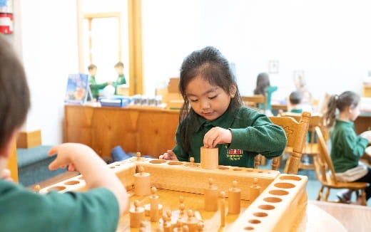 a group of children playing chess