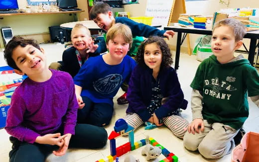 a group of children sitting on the floor