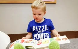 a boy sitting at a table