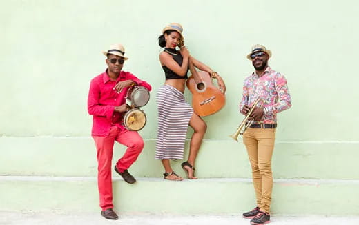a group of people holding instruments