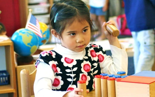 a little girl with a flag on her head