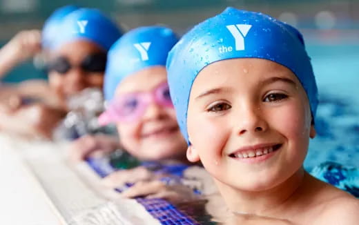 a child wearing a blue hat